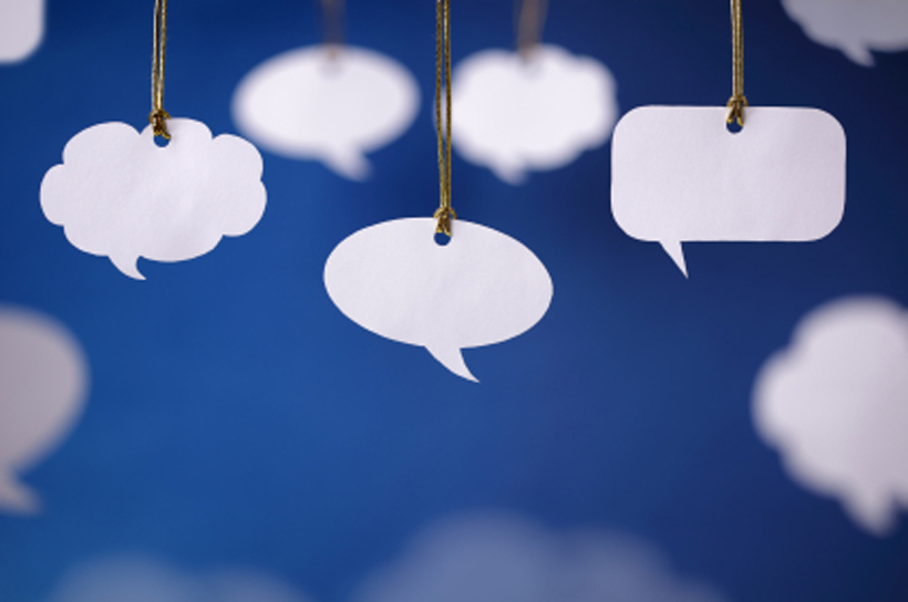 Blank white speech bubbles hanging from a cord